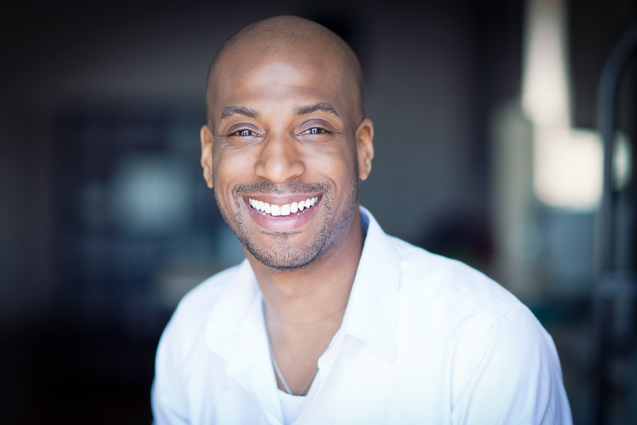 Smiling man shows off his white teeth.