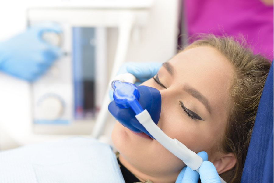 young woman undergoing sedation dentistry to relieve anxiety