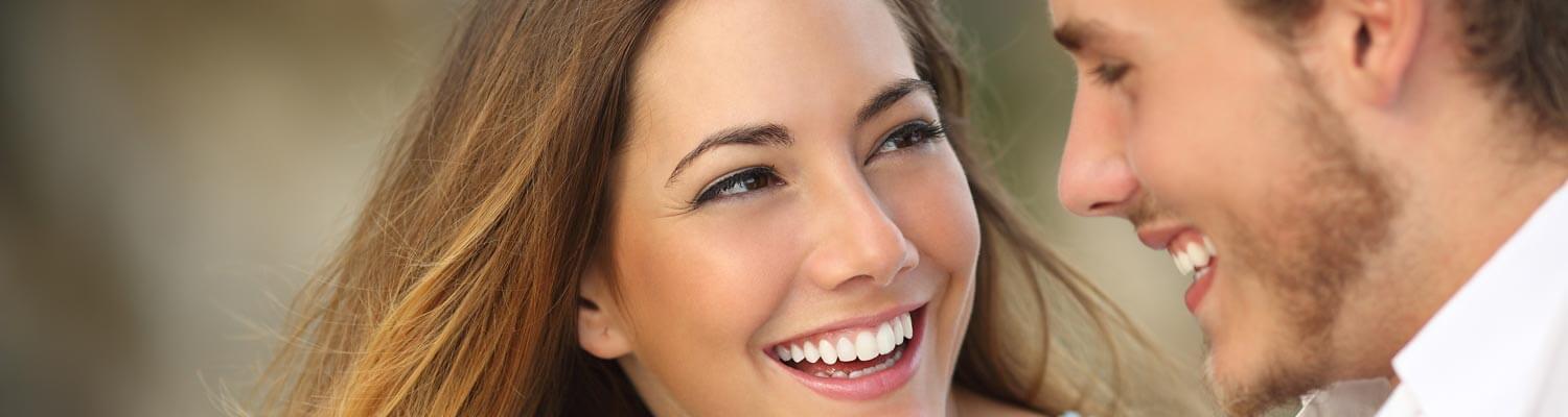 young couple with beautiful smiles