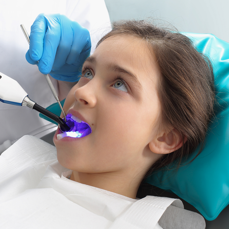 young girl at the dentist