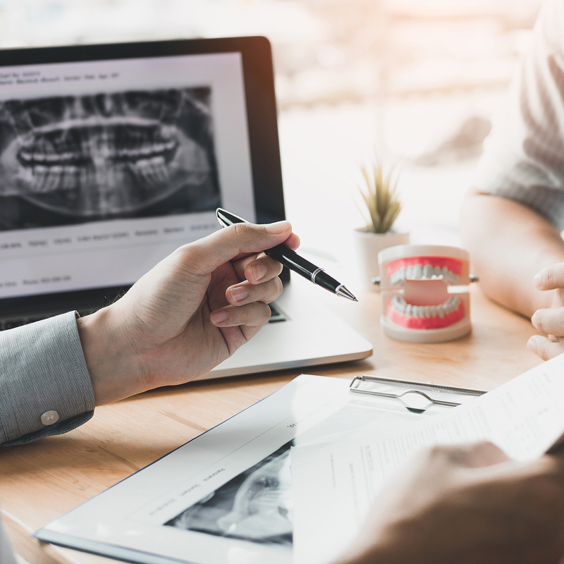 desk with dental mouth model